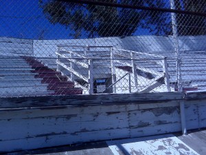 Saugus Speedway; closed to racing but open to swap meeting. Has aged with character. These stands were already second-hand when installed in 1950.